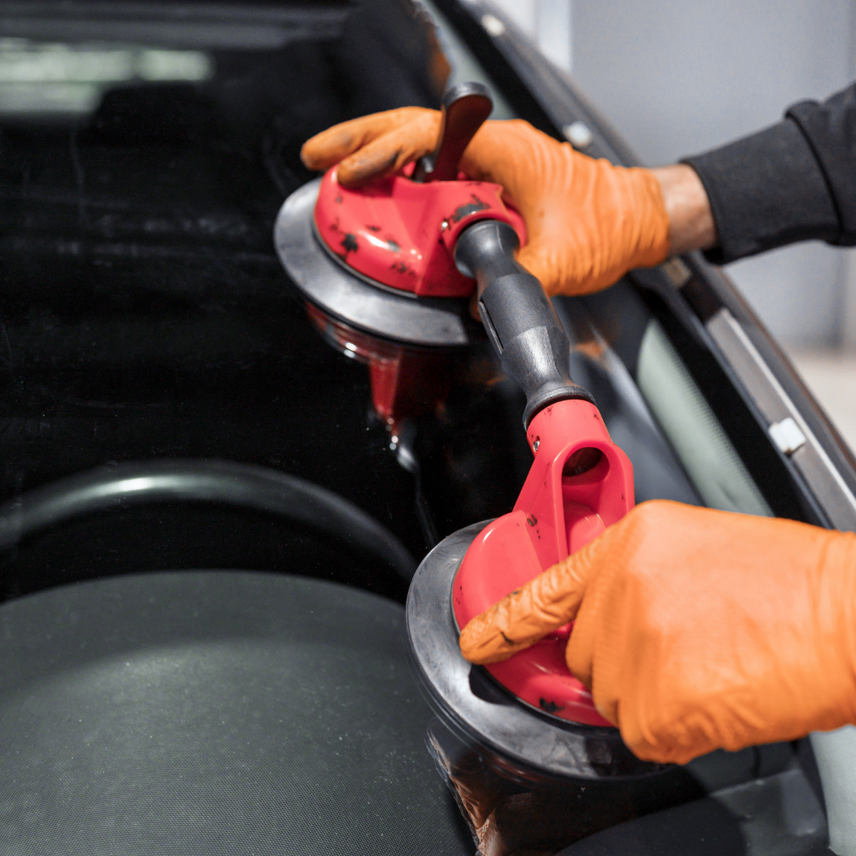 Step-by-Step Guide to Auto Glass Repair showing a technician fixing a windshield chip