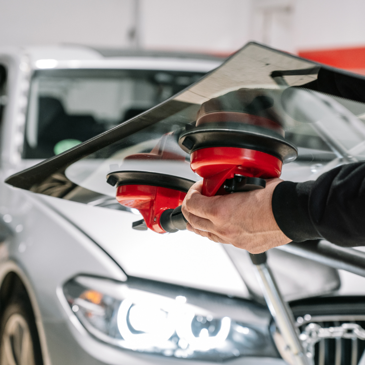 Repair or Replace Your Windshield - Technician Fixing a Chip