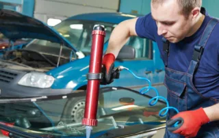 Auto Glass Repair and Replacement service, fixing a chip on a windshield.
