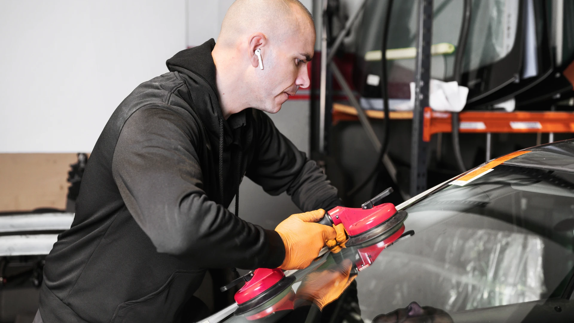 Auto Glass Repair & Replacement: What Every Driver Must Know 2 Certified technician performing auto glass repair & replacement on a cracked windshield